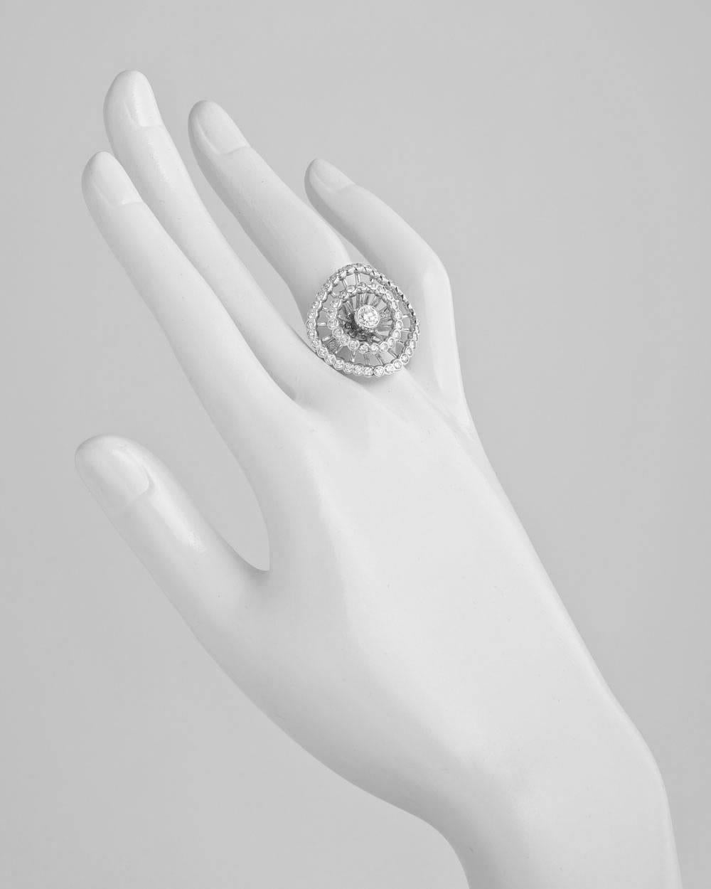 Ma Jolie openwork diamond cocktail ring, featuring one inner circle and one wider outer circle of round diamonds, all surrounding a larger bezel-set round diamond, the diamonds weighing approximately 1.60 total carats (the central larger diamond