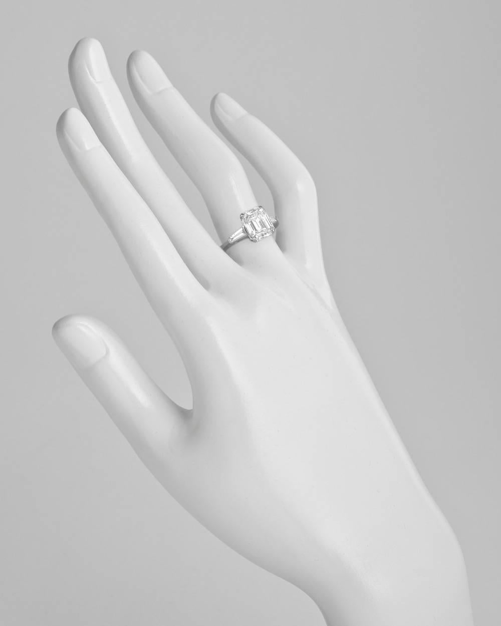 Diamond engagement ring, showcasing a near-colorless emerald-cut diamond weighing 3.21 carats (G-color/VS2-clarity), with two tapered baguette-cut diamonds weighing approximately 0.18 total carats, mounted in platinum. Accompanied by the GIA