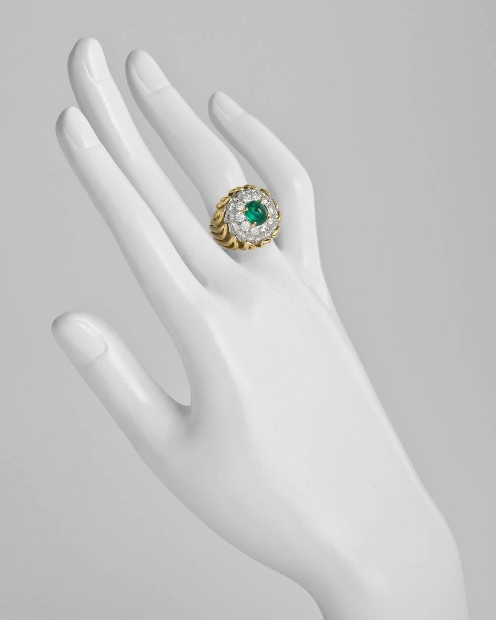 Emerald and diamond dome ring, centering on a natural cabochon-cut emerald weighing 2.00 carats, with a pavé diamond surround comprising 34 circular-cut diamonds weighing approximately 2.60 total carats, mounted in 18k yellow gold and platinum,