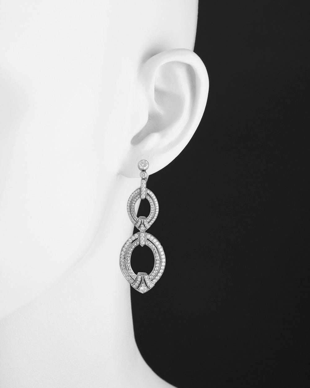 Drop earrings, featuring articulated oval-shaped links set with a double row of round diamonds, in 18k white gold. Diamonds weighing 2.00 total carats. 2.15