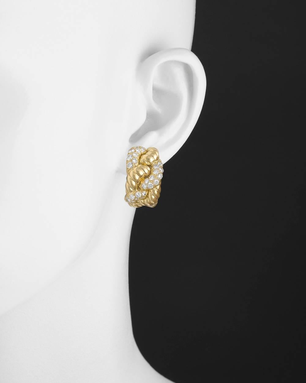 Gold and diamond woven earclips, set with fine colorless round brilliant-cut diamonds weighing approximately 3.12 total carats (F color, VVS1-VVS2 clarity), in 18k yellow gold, signed Boucheron. Clip backs. Just under 1" long and 0.6" wide