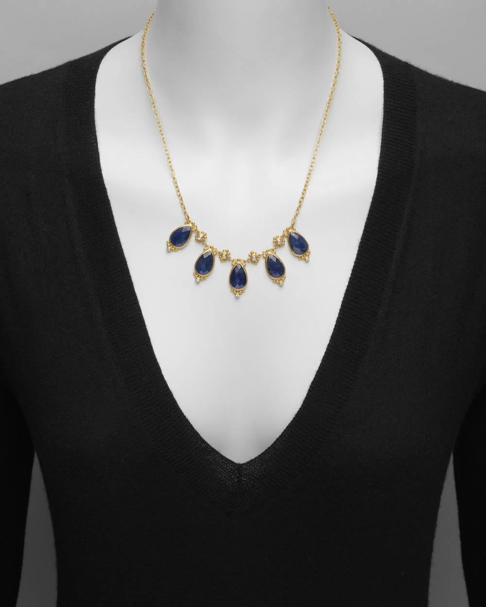 "Elements" sapphire fringe necklace, with five pear-shaped faceted sapphires suspended from a gold link chain with round brilliant-cut diamond accents, in 24k and 22k yellow gold, signed Gurhan. Sapphires weighing approximately 25.35 total
