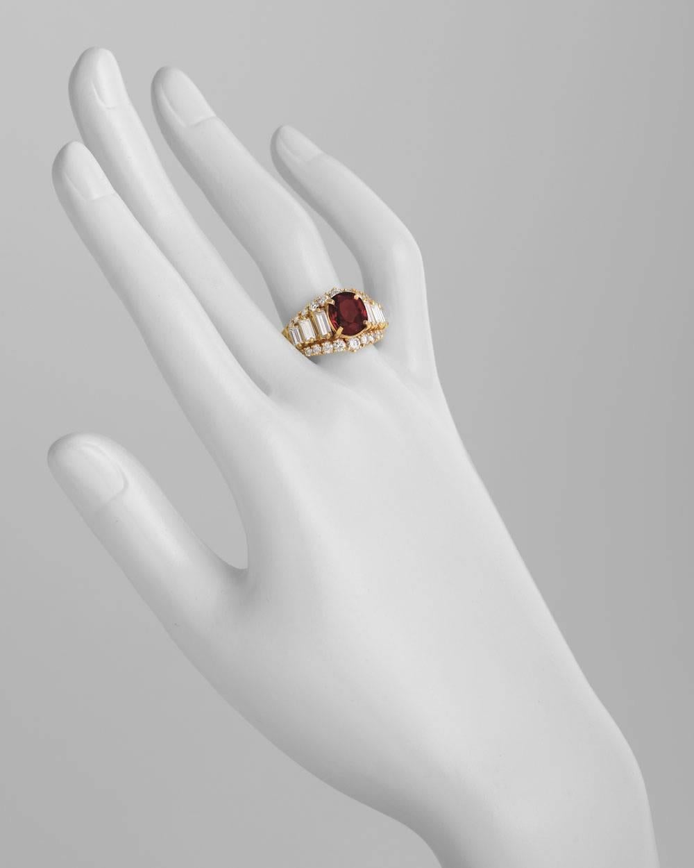 Ruby and diamond dress ring, centering an oval-shaped ruby weighing approximately 3.03 carats, flanked by graduated baguette-cut diamonds to the graduated circular-cut diamond surround, the diamonds altogether weighing approximately 1.81 total