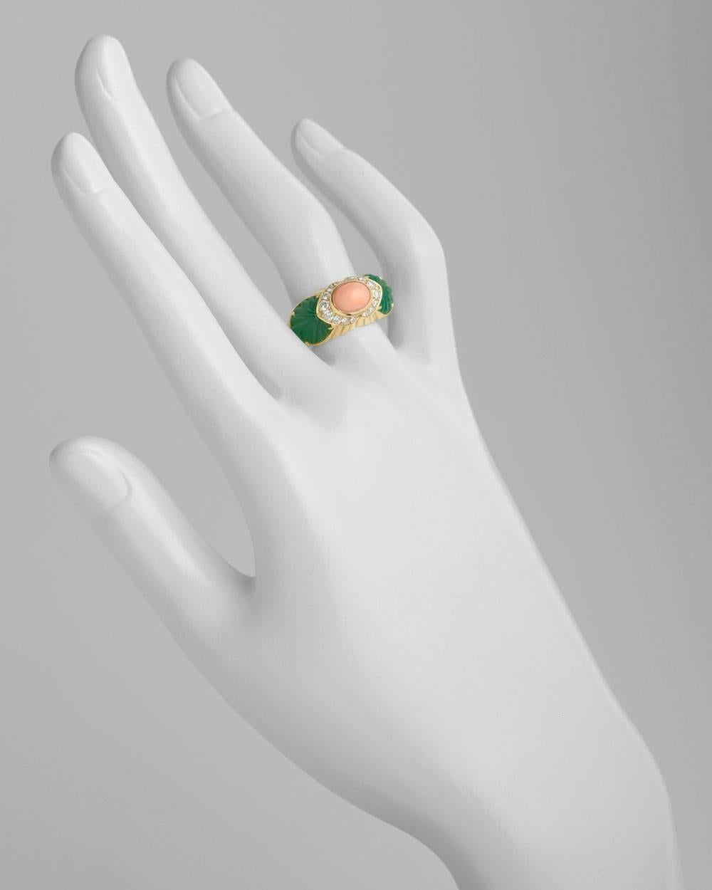 Dress ring, centering an oval-shaped cabochon pink coral flanked by round diamond accents to fluted chrysoprase at either shoulder, mounted in polished 18k yellow gold with a fluted profile, numbered R06637, signed Cartier. Size 6.5 (marked size 50,