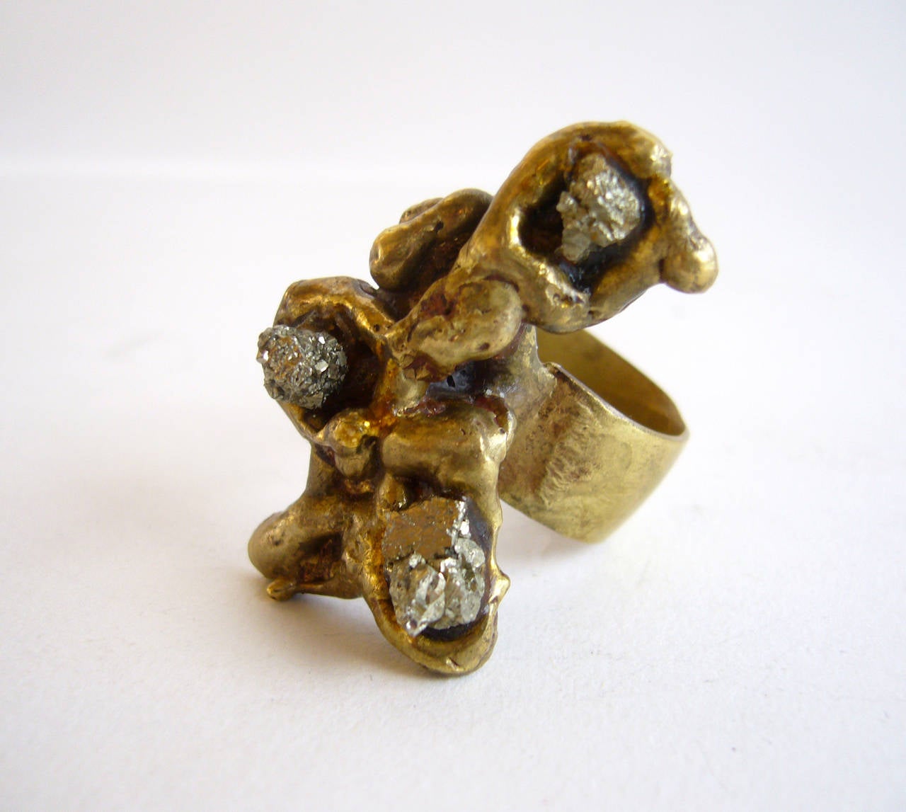 An organic bronze and pyrite ring created by Pal Kepenyes of Acupulco, Mexico. Ring is in very good vintage condition and signed Pal Kepenyes on shank.  Size 7.