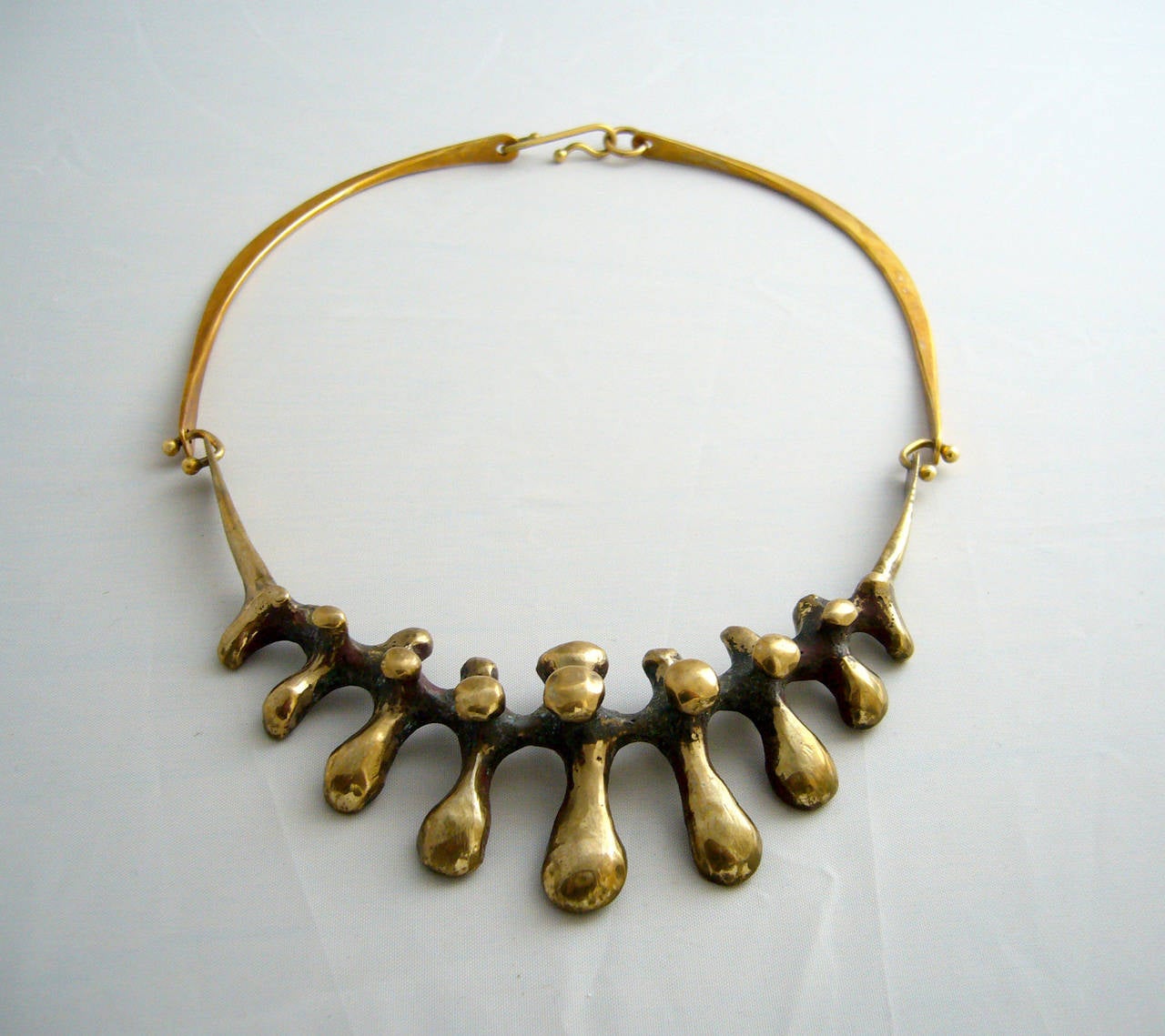 A welded drippy bronze hinged necklace created by Jack Boyd, circa 1960's.  Necklace has a wearable length of  approximately 17.5
