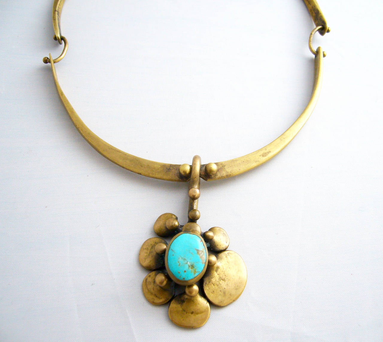 A bronze and turquoise necklace created by the Jack Boyd Studio of San Diego, circa 1960's.  Necklace has a wearable neck length of about 16