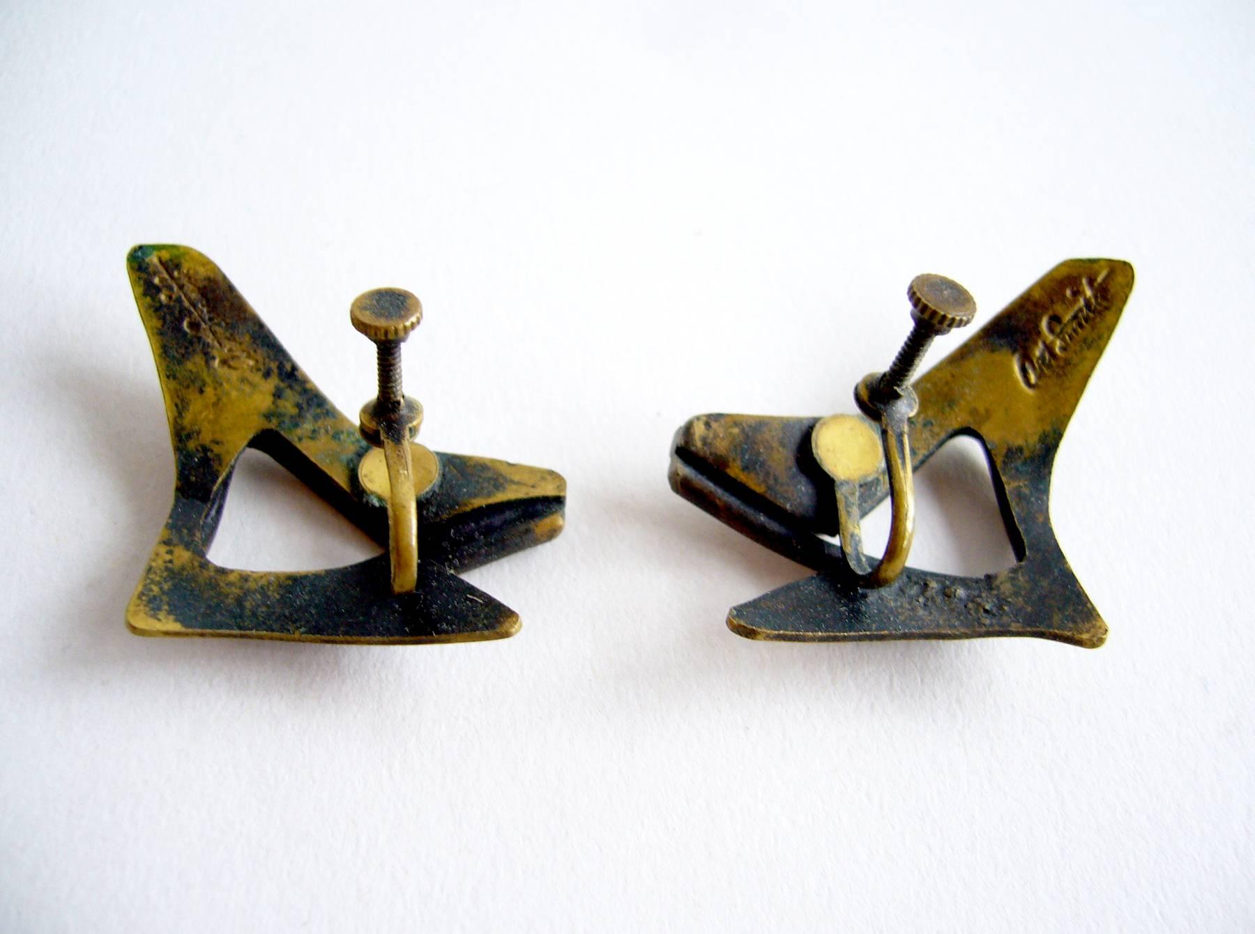 Brass modernist earrings created by Art Smith of New York City, New York.  Earrings are of the screw back variety and measure 1 3/8" by 1 1/8" and are signed Art Smith on verso.  In excellent vintage condition.  