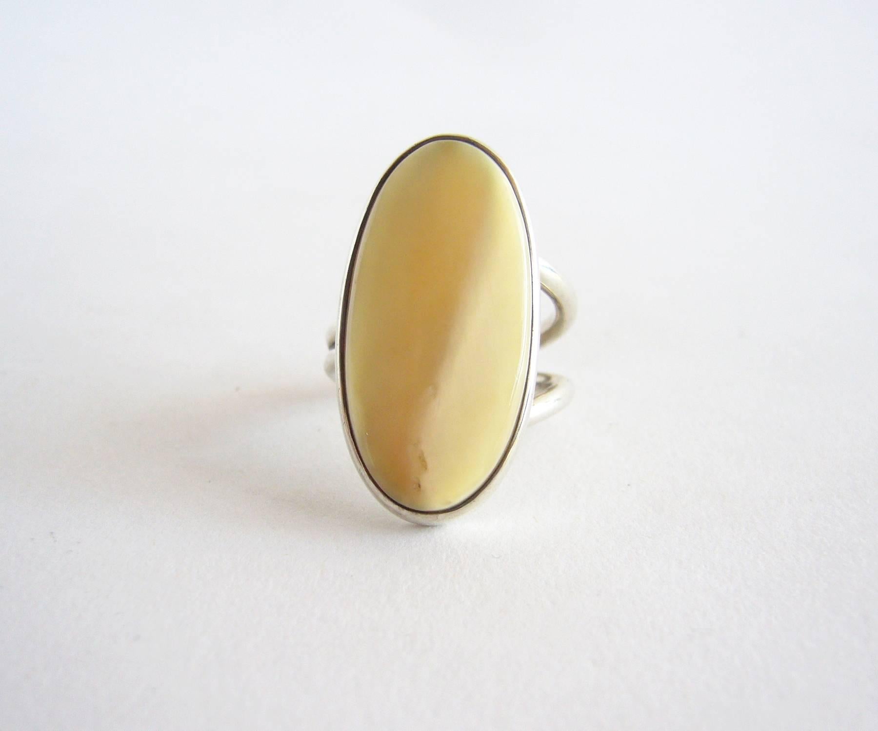 Sterling silver and bone American modernist ring created by Jack Nutting of San Francisco.  Ring is a finger size 4.5 - 5 and could be resized by a competent jeweler.  Face of the ring measures 1 1/8