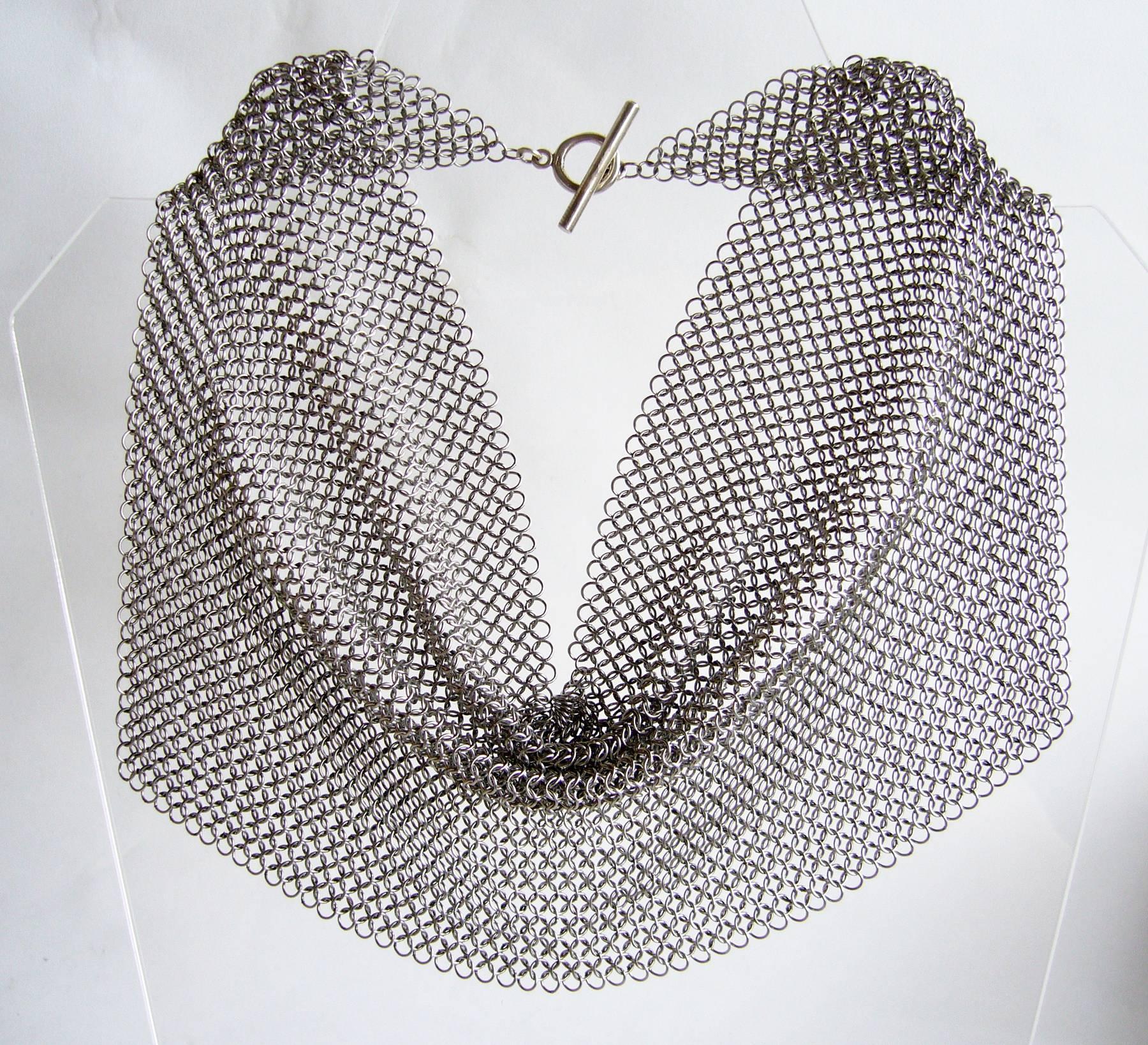 1990's stainless steel chain maille drape necklace created by Allison Stern of San Francisco, California.  Necklace has a wearable neck length of about 16"-16.5" and measures 17.5" by 4.75" when laid flat.  Unsigned. In excellent