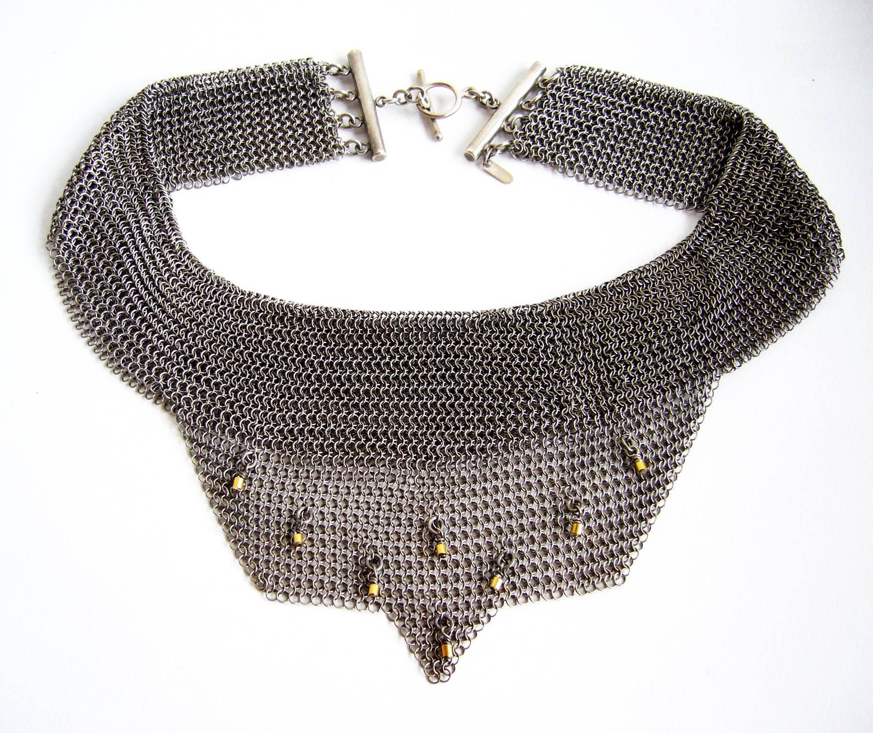 Allison Stern sterling silver chain maille mesh necklace embellished with 18k gold accents on the bib section.  Necklace has a wearable neck length of 16.5