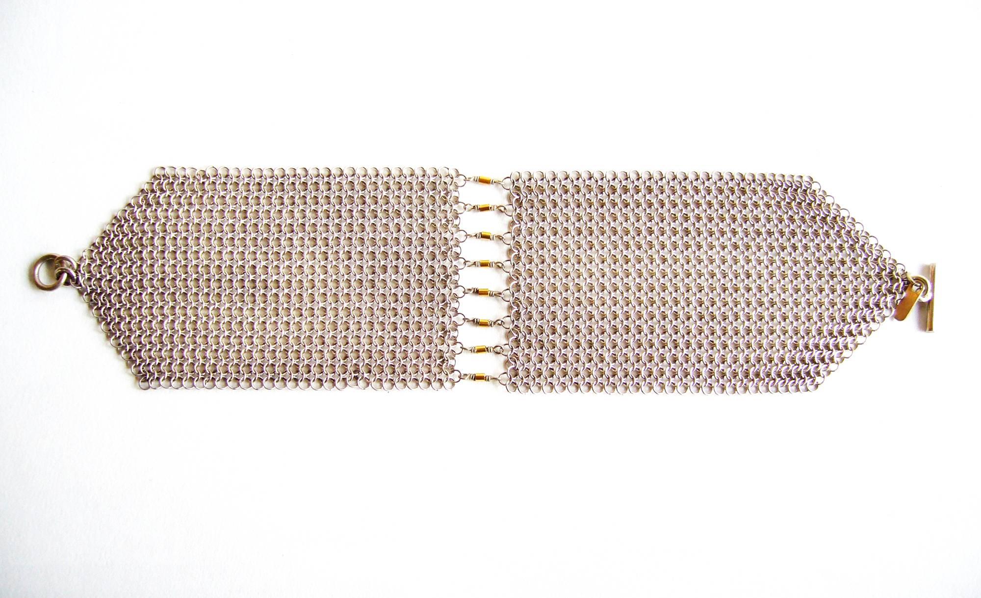 Allison Stern sterling silver chain maille mesh bracelet embellished with 18k gold accents at center.  Bracelet measures 6 1/2
