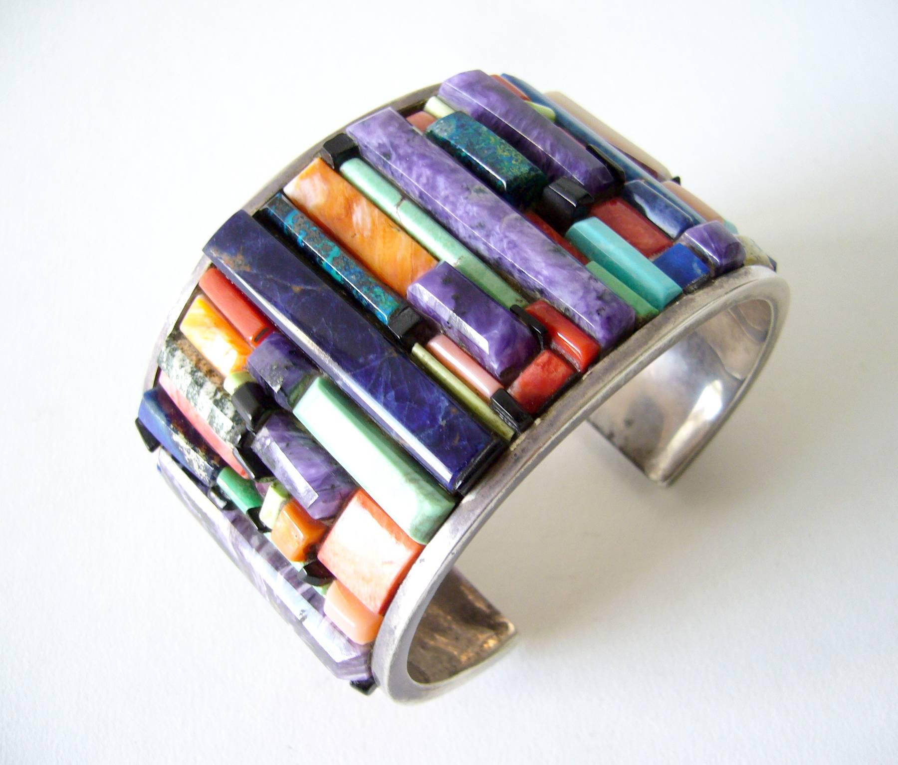 Large scale layered natural gemstone cuff bracelet created by Sedona, Arizona metalsmith Don Staats. Many rare, semiprecious stacked gemstones include turquoise, lapis lazuli, coral, jet, shell and more.  Bracelet measures 2.25