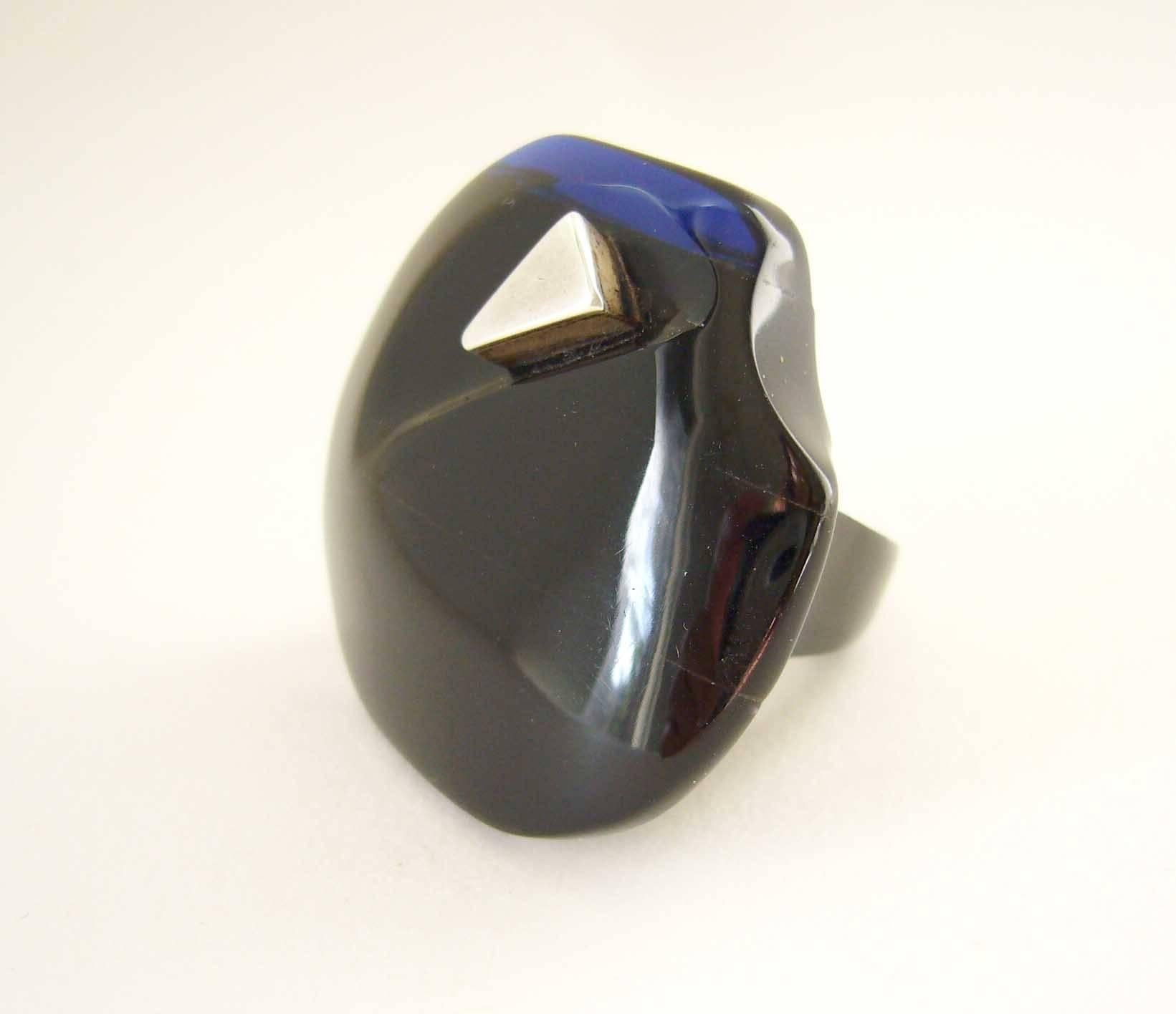 Layered blue and black acrylic with sterling silver triangular inlay created by Suzanne Somogy of Paris, France circa 1970's.  Light in weight and of good scale, the face measures about 1.5