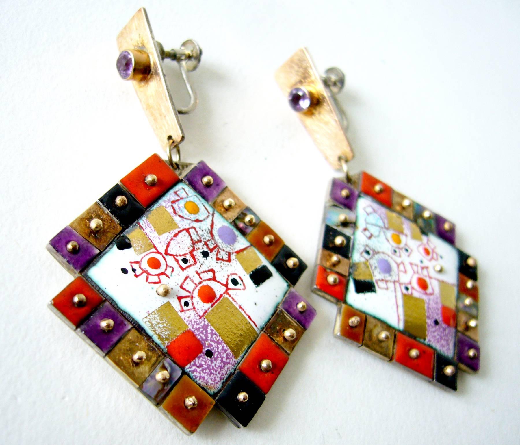 Colorful enamel mosaic earrings created by master jeweler Earl Pardon, circa 1987.  Earrings feature an enamel center panel of abstract design surrounded by small tiles of mother of pearl shell and enamel. These are attached with 14k gold studs and