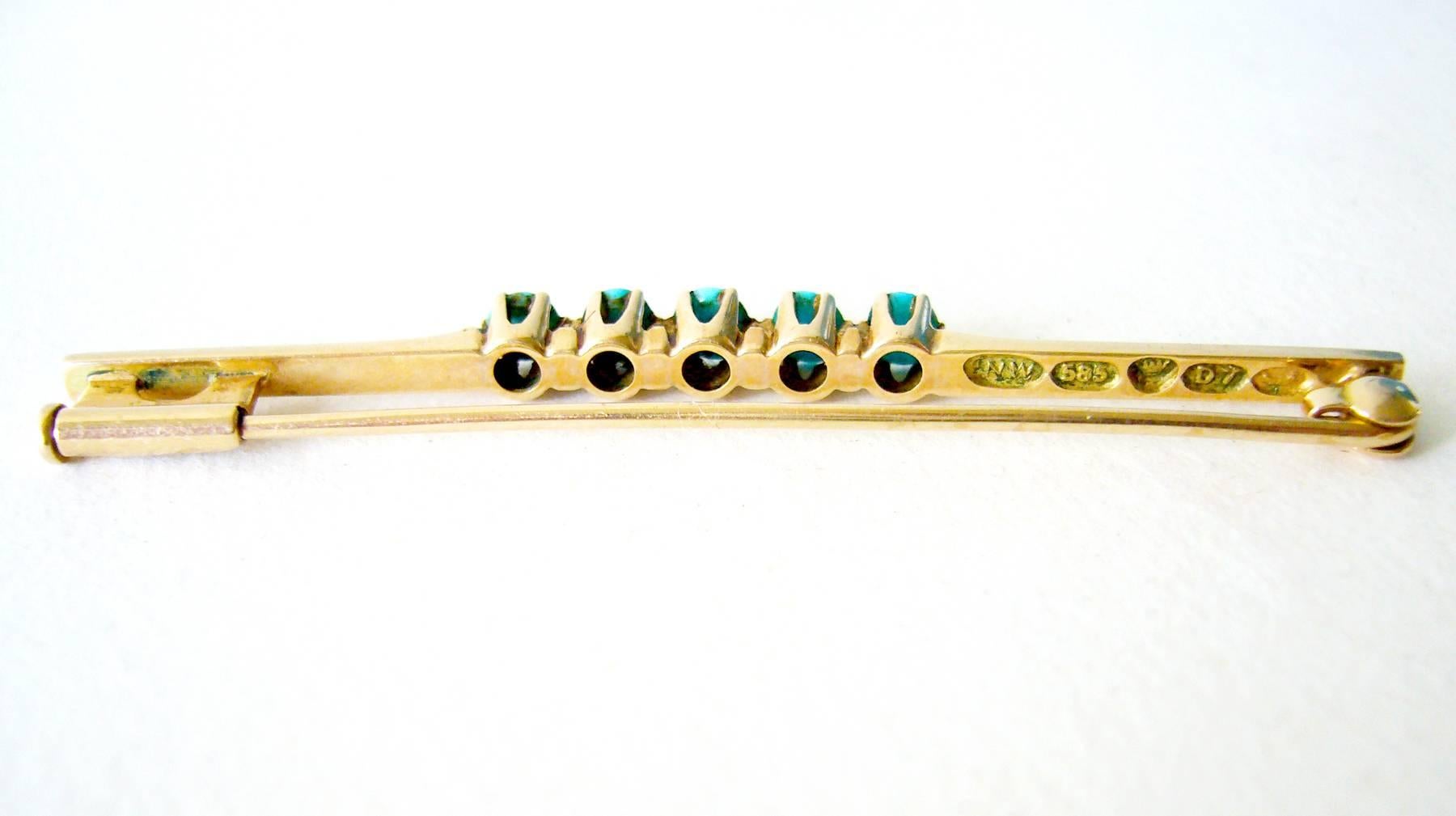 Persian turquoise set in 14k gold bar pin created by the Nils Westerback manufacturer Helsinki, Finland.  Pin measures 1/8