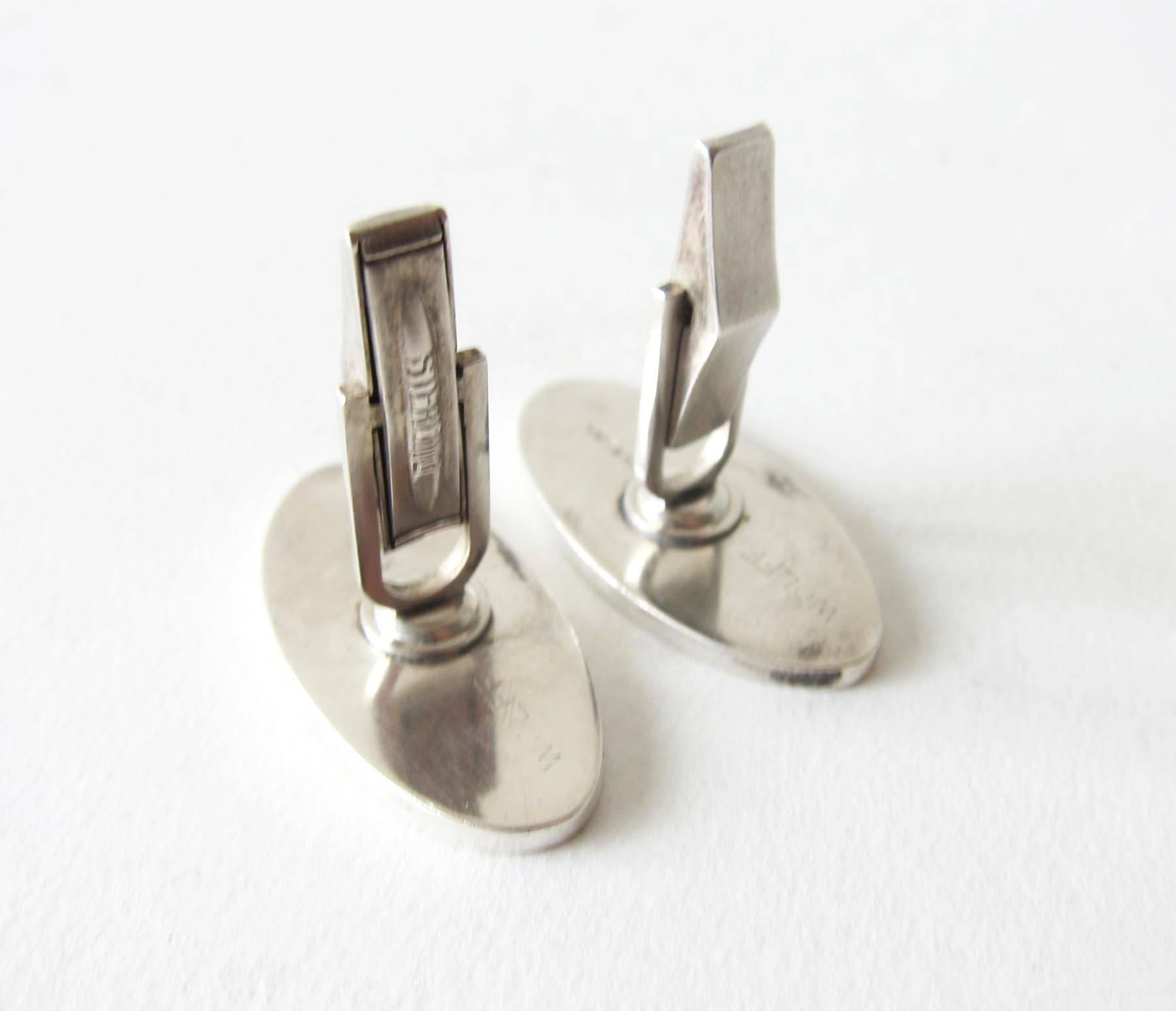 Sterling silver and copper American modernist cufflinks by jeweler Wolff.  Cufflinks measure 1.25