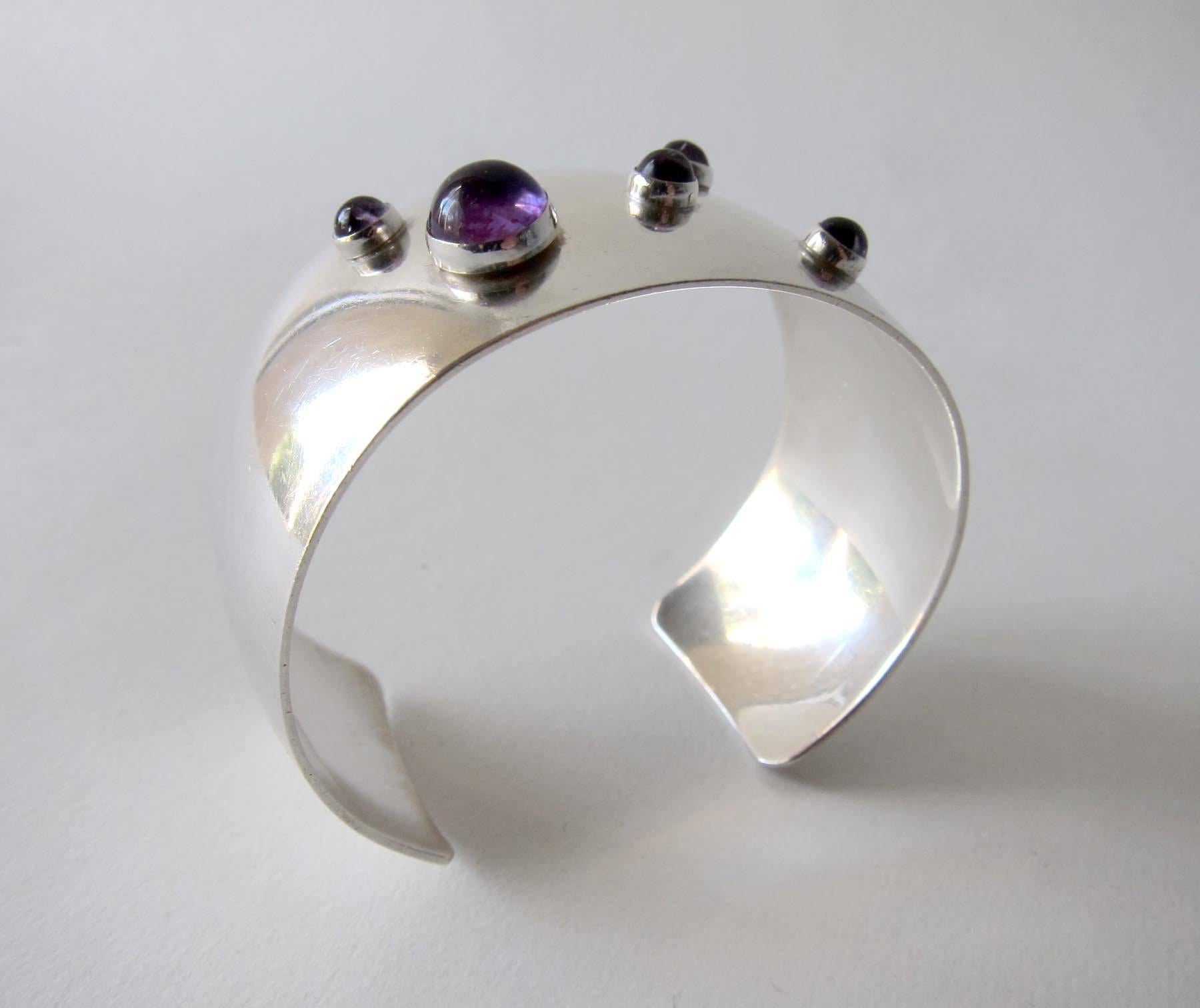 Sterling silver cuff bracelet featuring five amethyst cabochon stones created by Niels Erik From of Denmark.  Cuff measures 8