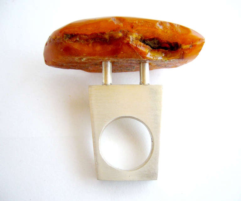 A cast sterling silver and amber ring designed by Heidi Abrahamson of Phoenix, Arizona.  Ring is a finger size 6 and stands about 1 5/16