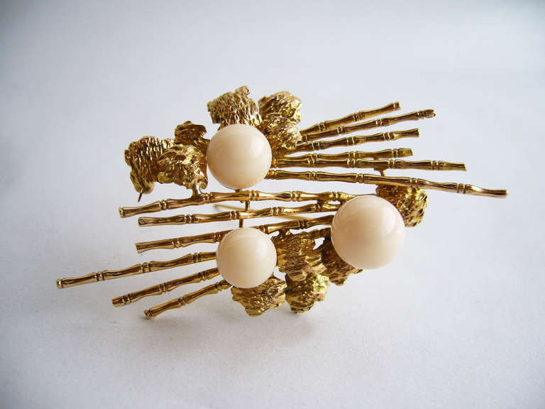A lovely 14k gold and angel skin coral brooch circa 1950's.  It measures 3