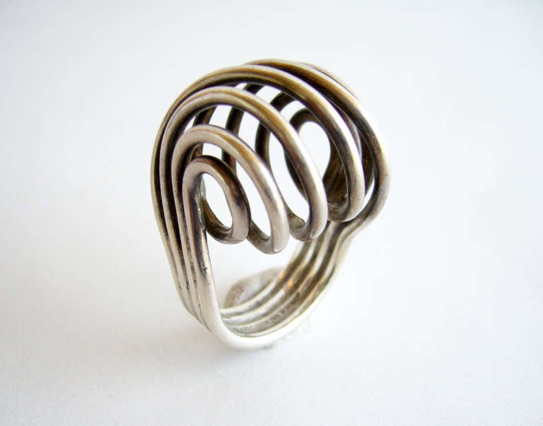 A rare, spiraled sterling silver ring designed by Anna Greta Eker for the Plus silversmithy, Norway.  Interesting design and quite a showpiece when worn.  Ring is a finger size 6 1/2 and is signed AGE, +, 925S, Sterling, Norway.  In very good