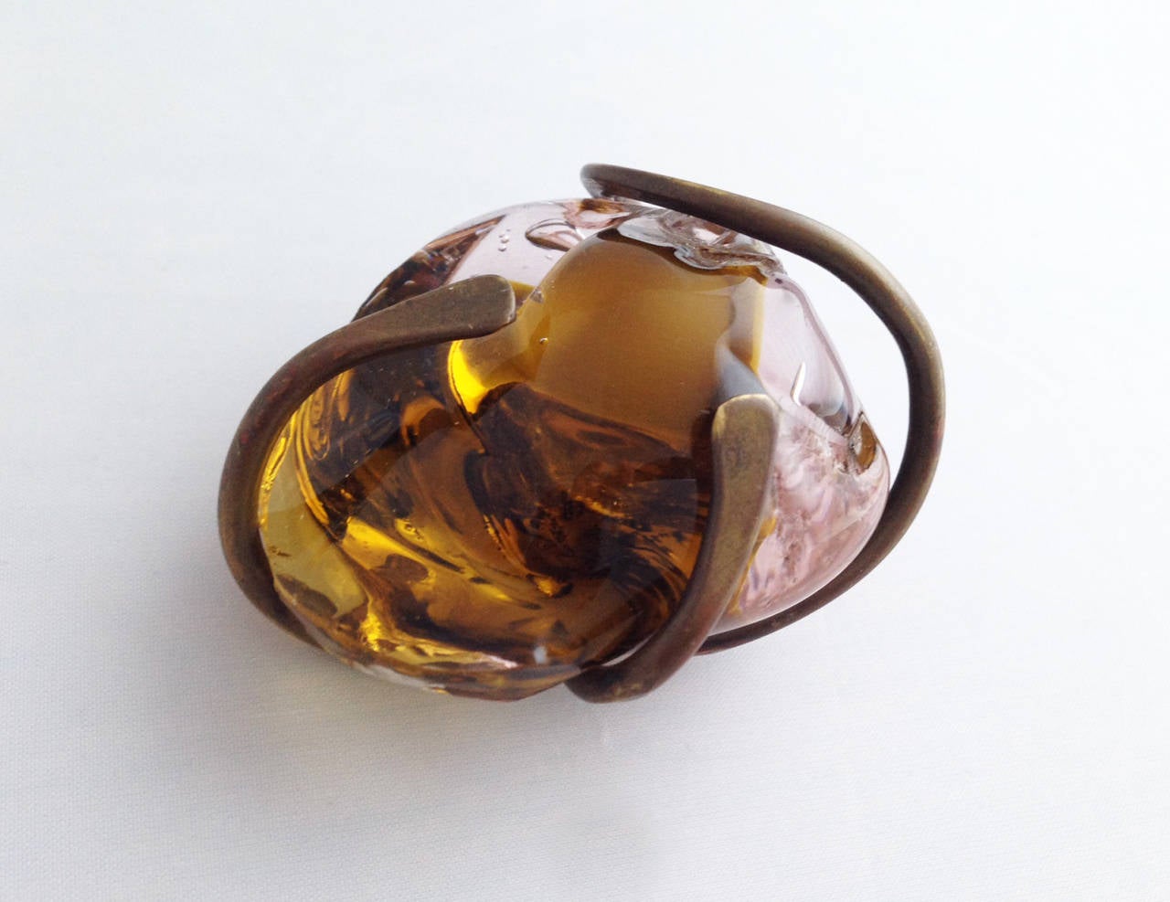 A rare, handmade bronze and hand blown glass pendant created by sculptor Claire Falkenstein of Venice, California.  Unconventional pendant is large, measuring 2 5/8