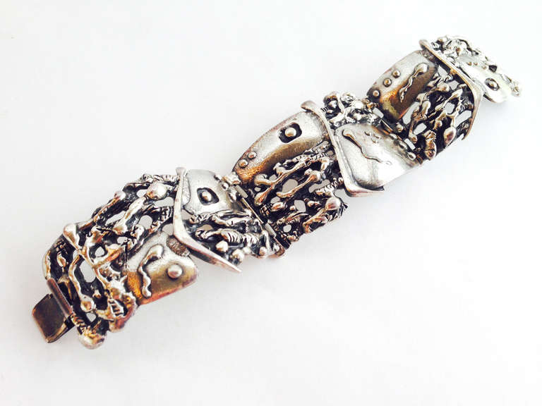 Brutalist cast pewter bracelet designed by Guy Vidal of Canada, circa 1970's.  Bracelet is comprised of three large, curved links and has a tight clasp.  It measures 7.5