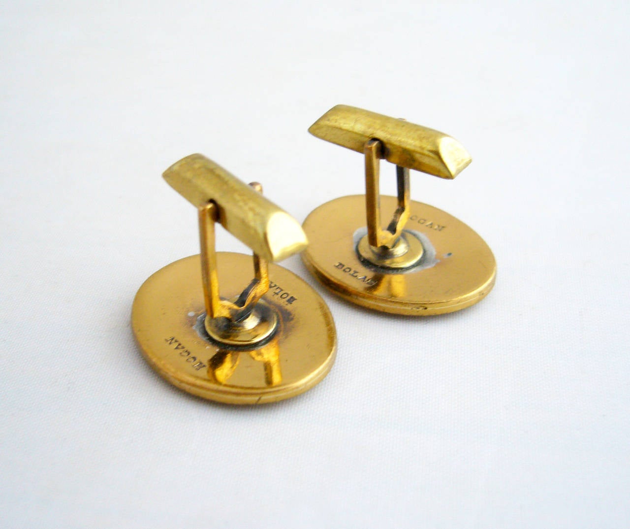 A pair of bronze modernist cufflinks designed by Robert Hogan and Deborah Bolas of the Hogan-Bolas Company, circa 1960's.  Oval cufflinks feature a pierced design and measure 1
