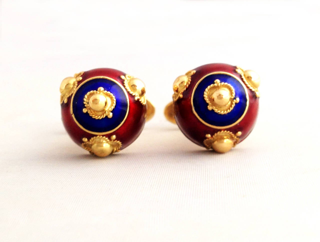 A pair of 1960's Baroque style 18k gold and enamel cufflinks made by Neiman Marcus.  Cufflinks measure 5/8