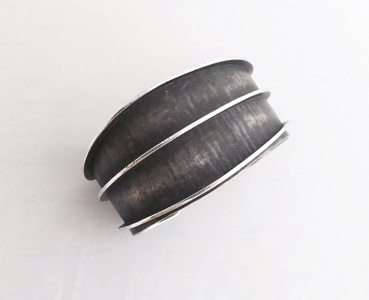 An oxidized, scribed sterling silver cuff bracelet by Lasnier. Cuff has about 7.25