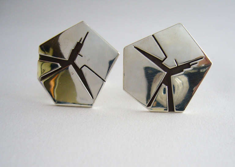 A pair of sterling silver crecked crater like cufflinks created by Miye Matsukata for Atelier Janiyé.  Cufflinks measure 1 1/8