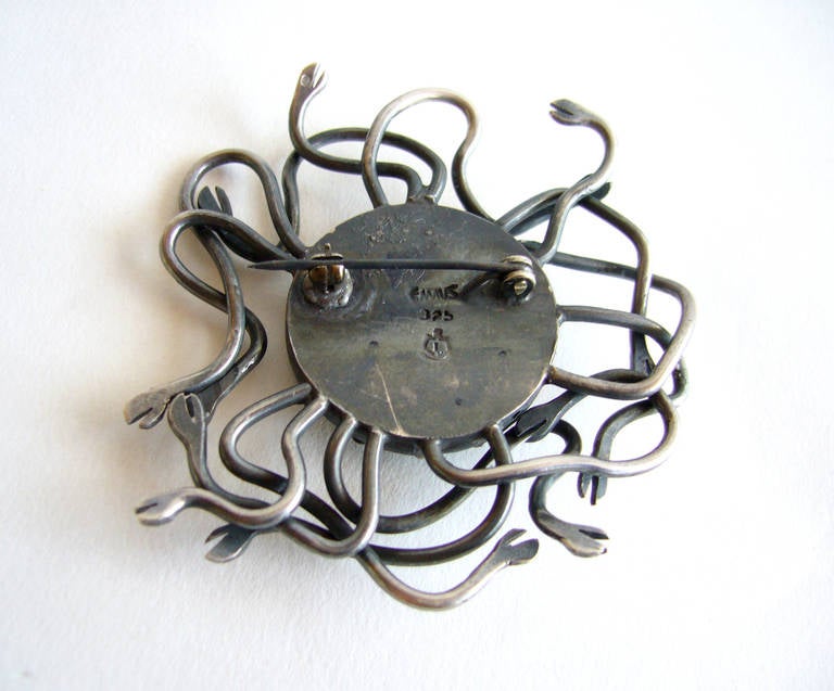 Medusa snaking sun brooch created by the Emaus workshop of the Benedictine Monks of Cuernavaca, Mexico, circa 1960's.  This rare brooch measures 2.25