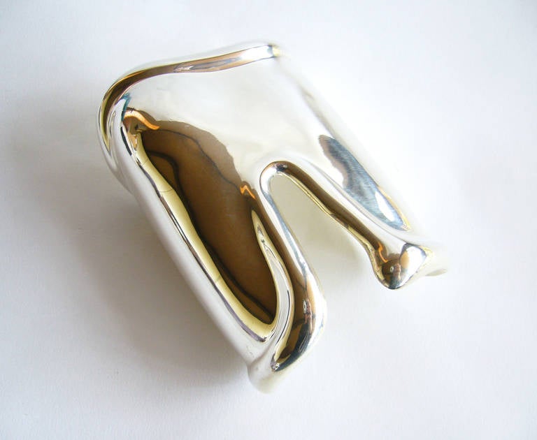 An Elsa Peretti for Tiffany & Co. sterling silver left bone cuff bracelet, circa 1975.  Cuff is the larger version and measures 4