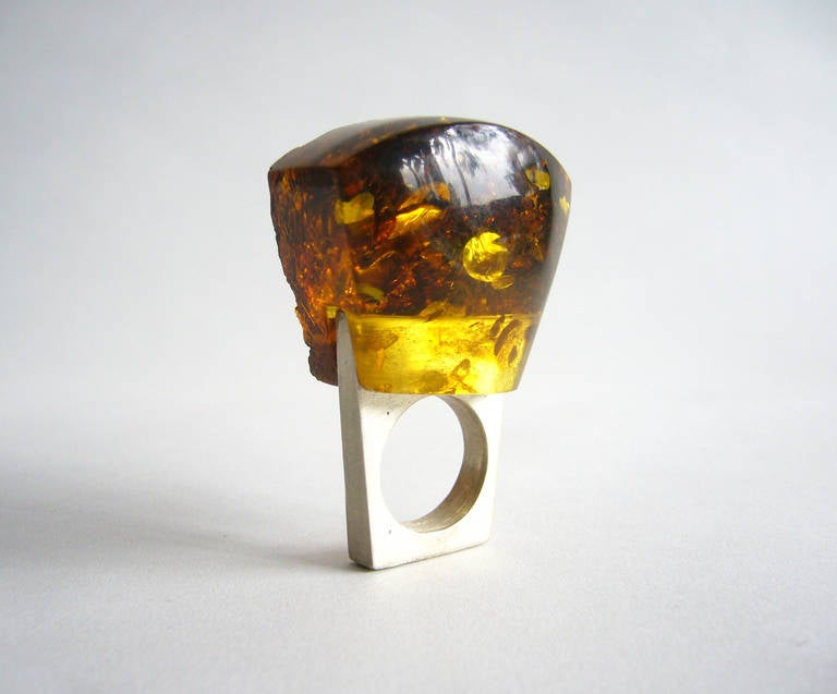 A sterling silver and fall color amber one of a kind ring, created by Heidi Abrahamson of Phoenix, Arizona.  Ring stands about 1.5" off the top of the finger and is a size 6. Signed Heidi, 925.  In fine condition.  