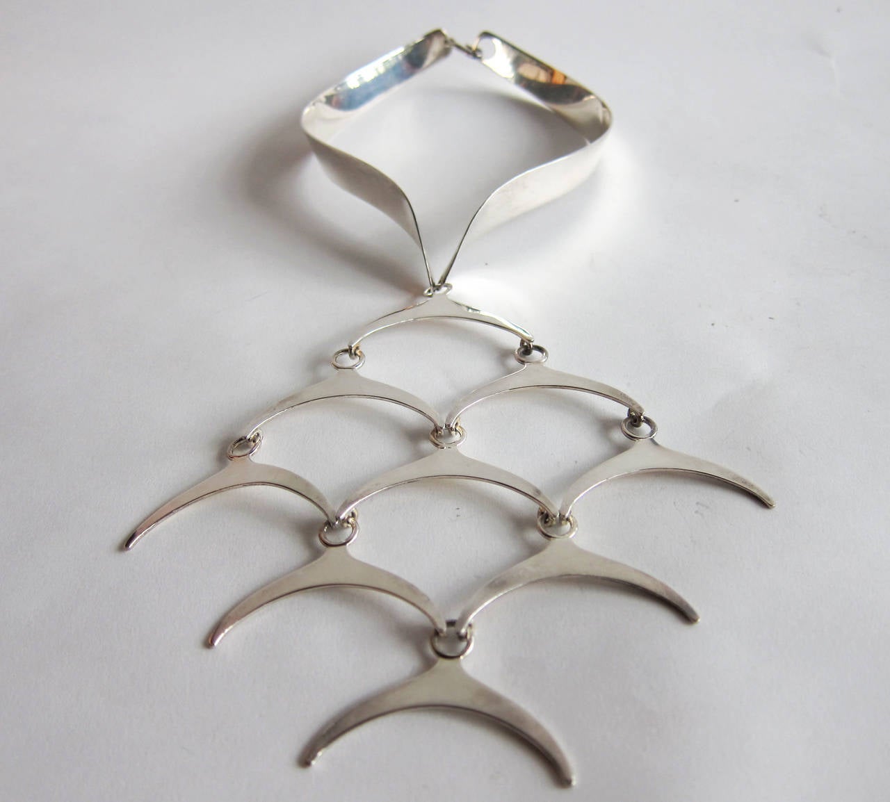 Sterling silver jointed large scale necklace created by Jose Puig Doria of Barcelona, Spain.  Necklace choker measures 15