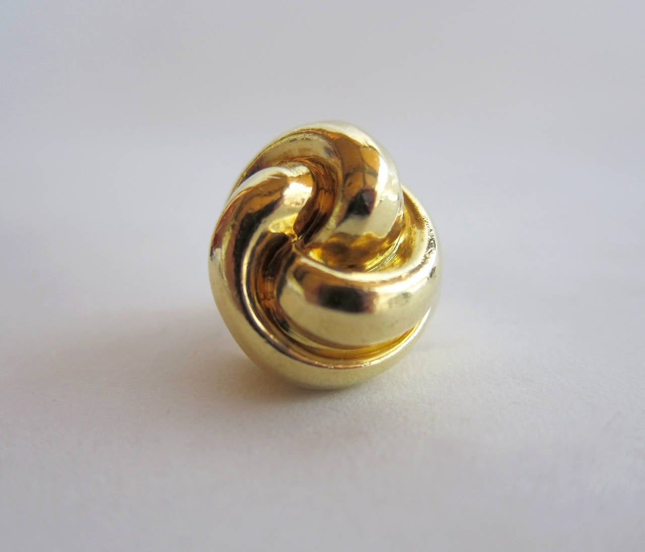 An 18k gold swirled knot cocktail ring by Tiffany & Co., circa 1980's.  Ring is a finger size 5.25 and in very good vintage condition.  Signed Tiffany & Co., 18k.  20.8 grams.