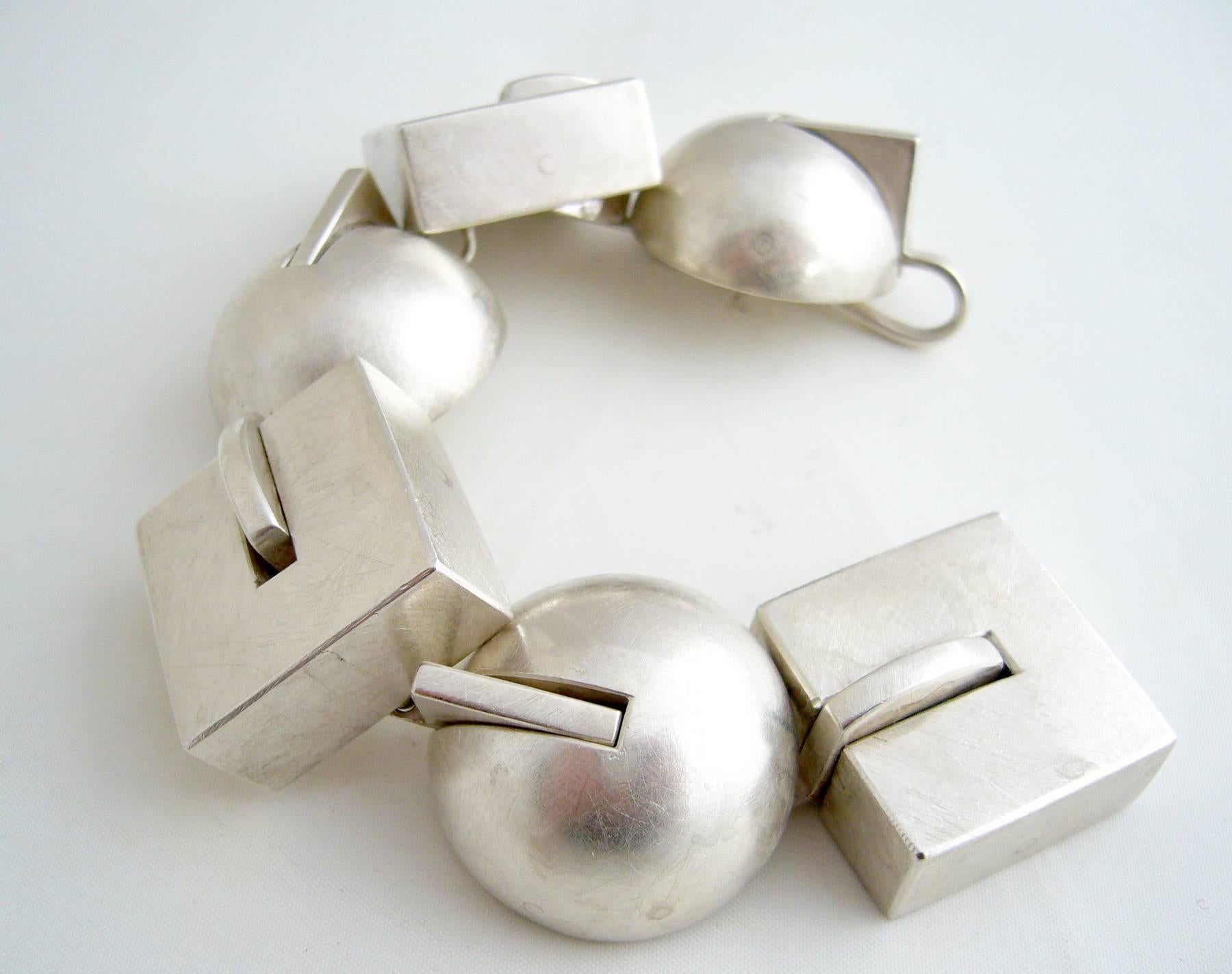 Brushed sterling silver post modernist bracelet with geometric elements by Sandra Enterline, circa 1992.  Bracelet measures 7