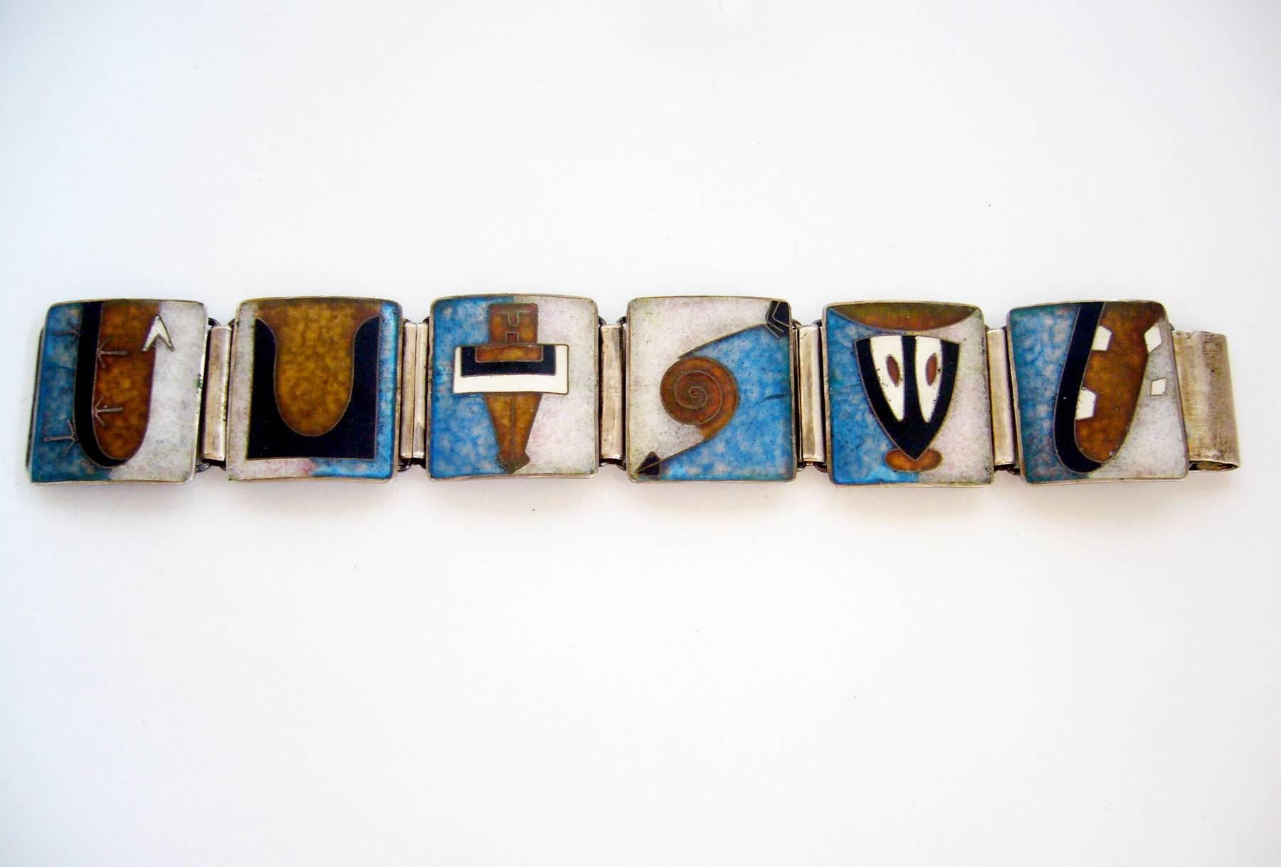 A moderne enamel over sterling linked bracelet, possibly made by Perli of Germany.  Bracelet has six counter enameled plaques that are reminiscent of Oskar Schlemmer's Bauhaus design.  Piece measures 7 1/4" long by 1 1/8" wide. Signed