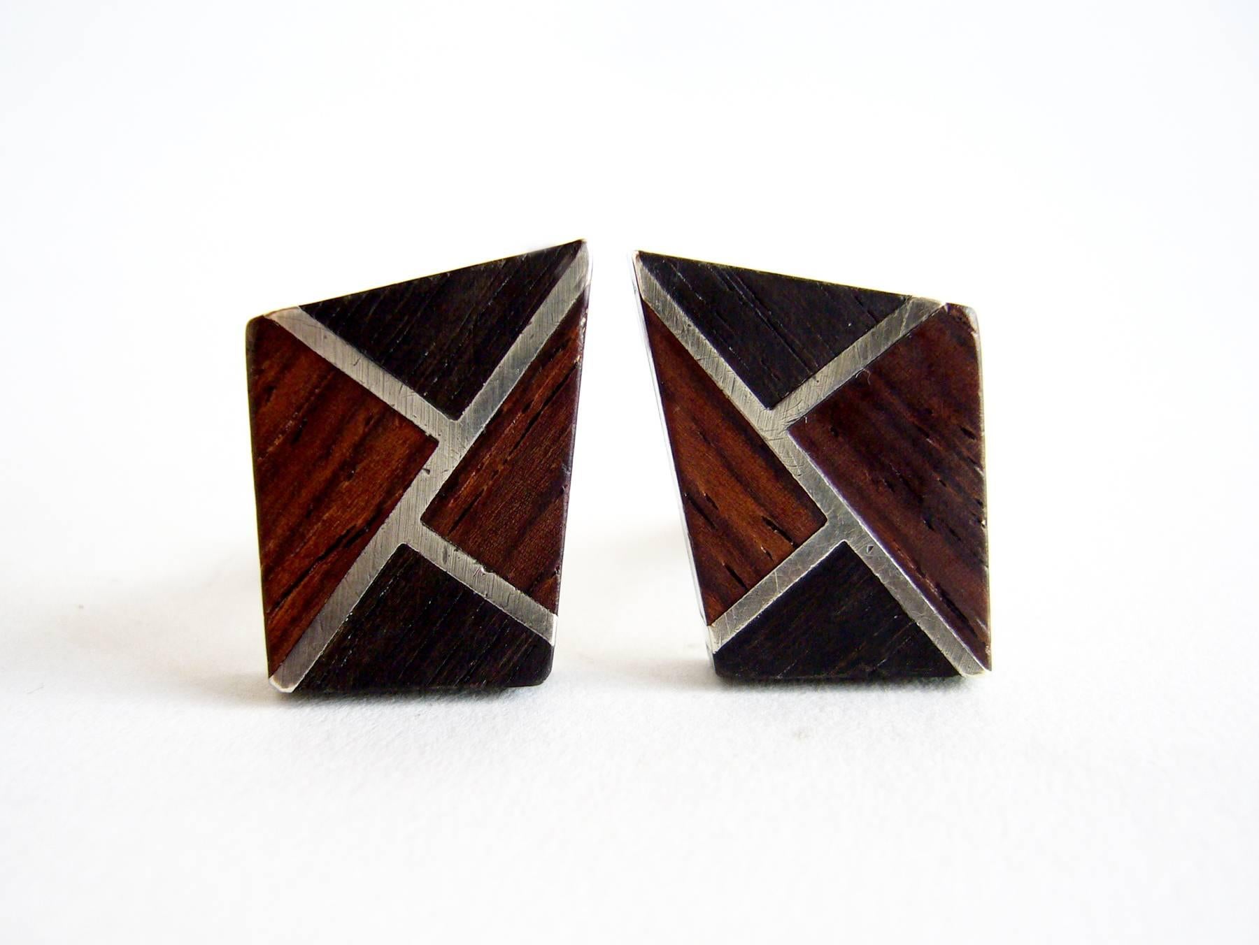 Sterling silver and exotic wood cufflinks designed by Esther Lewittes of Los Angeles, California.  Cufflinks measure 7/8