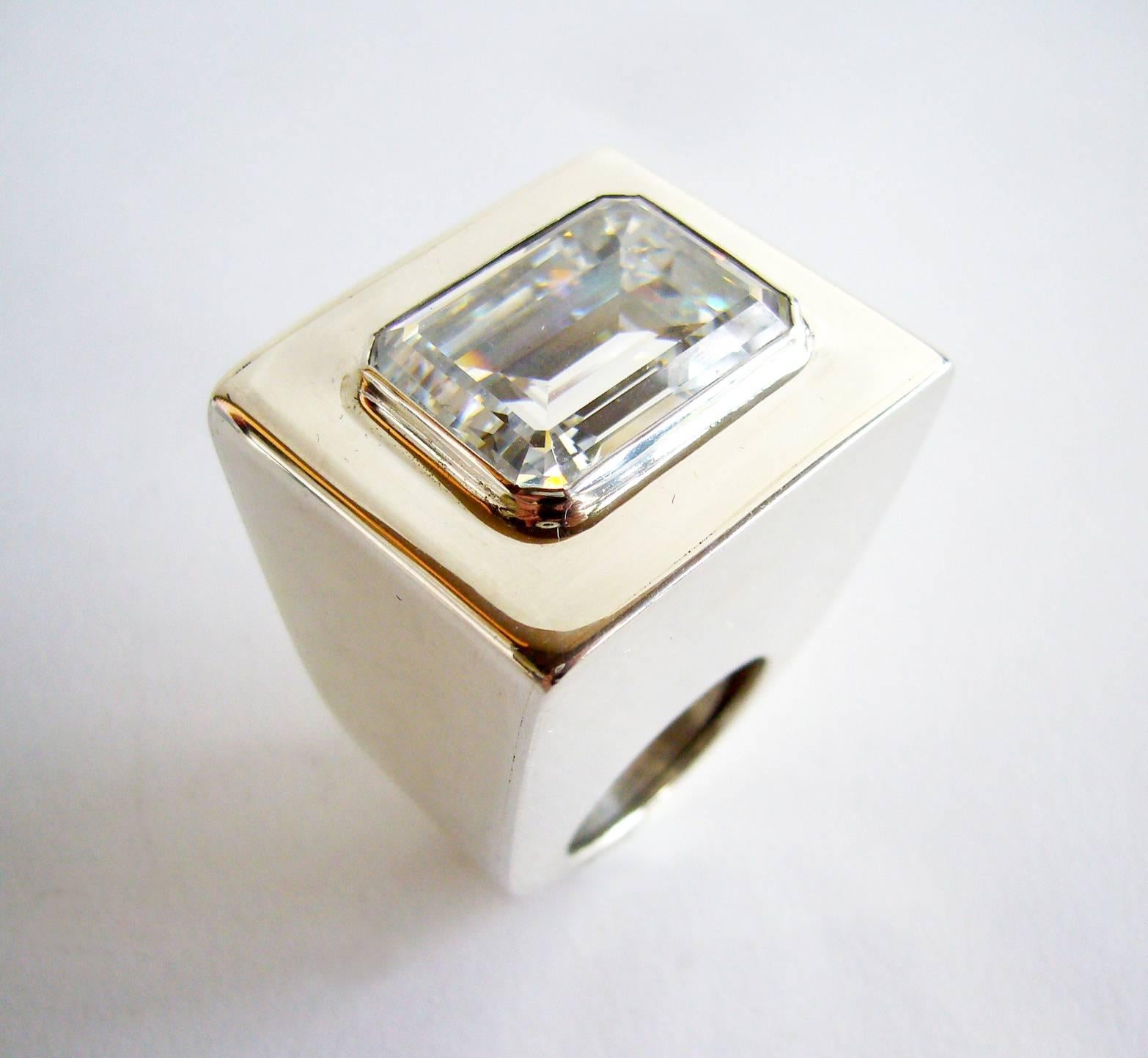 Large scale sterling silver with faceted crystal ring by Kalibré, circa 1985.  Ring is a finger size 7.5 - 8 and and stands 1