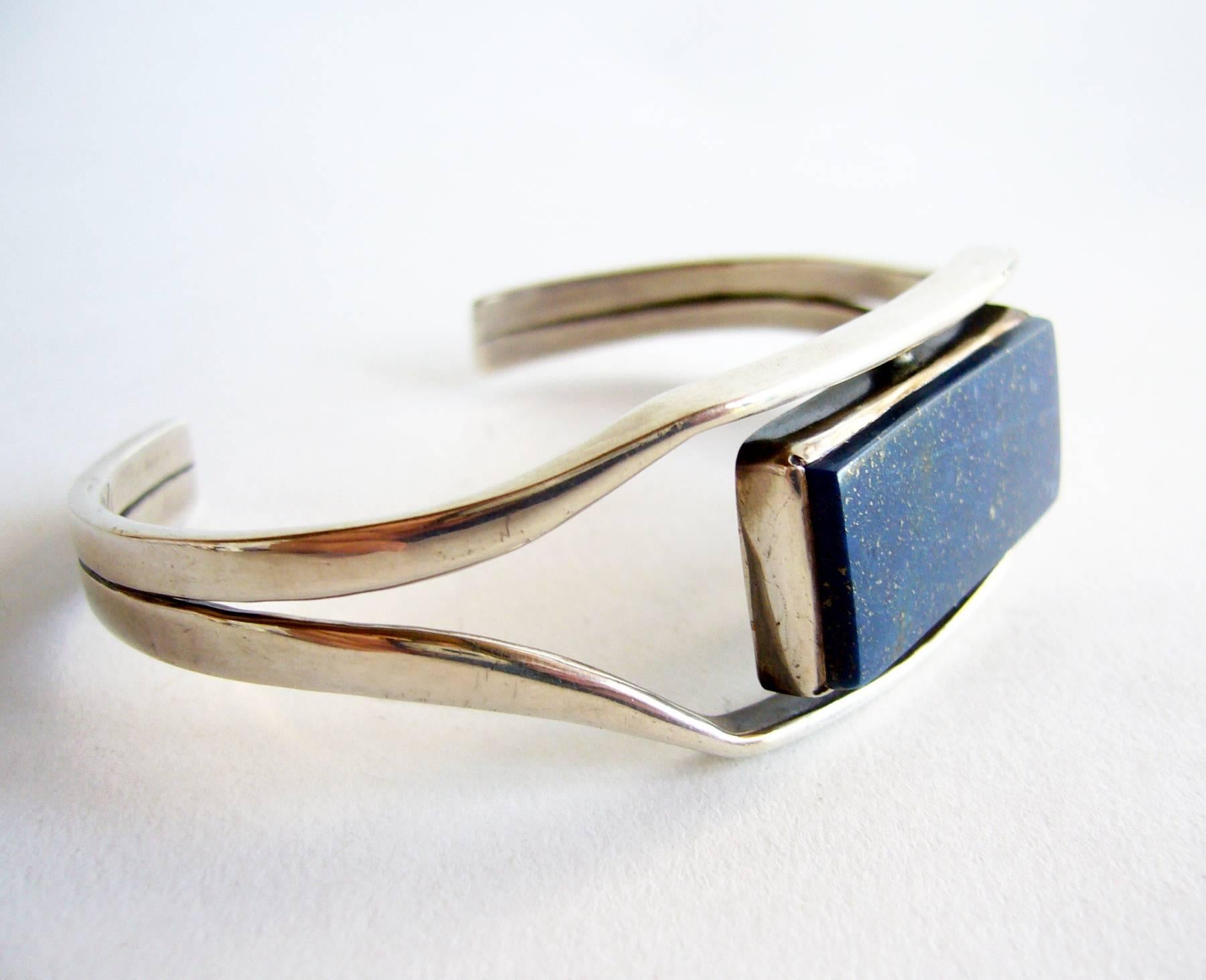 Sterling silver and lapis lazuli cuff bracelet created by Jack Nutting of San Francisco, California.  Bracelet has a wearable wrist length of 8.5