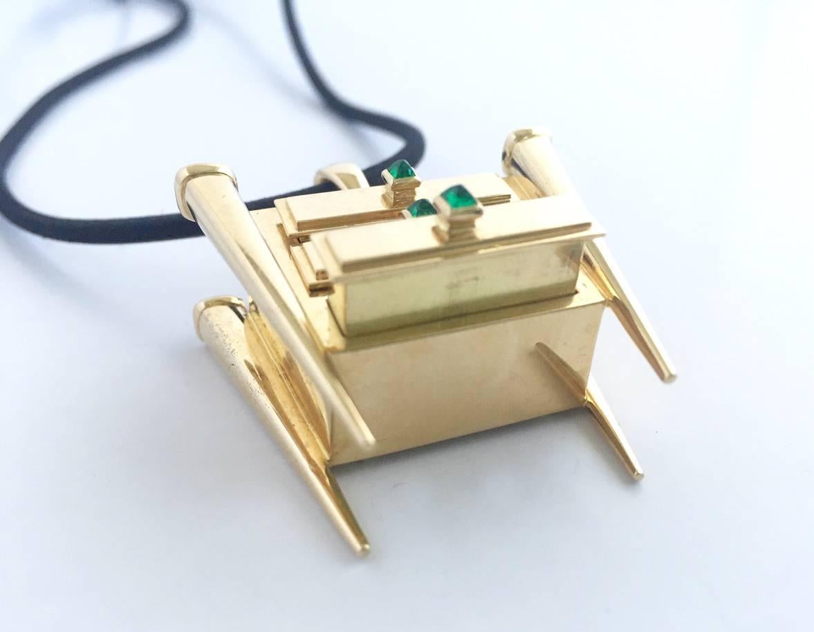 18k gold keepsake pendant with three movable drawers for secret belongings designed and created by Romain Saide, manufactured by Arnould Edition Paris, France.  
This piece was exhibited at Baselworld Switzerland in 1997. Saide was a designer for