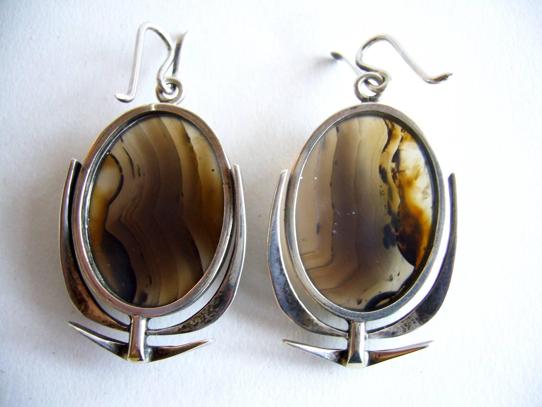 Highly crafted sterling silver and agate pierced earrings created by San Francisco modernist jeweler, Jack Nutting.  Earrings measure 1 3/4