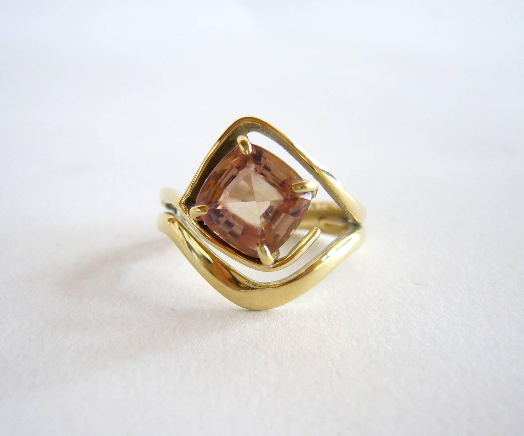 Gold ring with faceted tourmaline created by modernist jeweler Jack Nutting of San Francisco, California.  Ring is comprised of a stunning champagne tourmaline stone set in a free form setting.  Finger size 6 and suitable for an engagement or