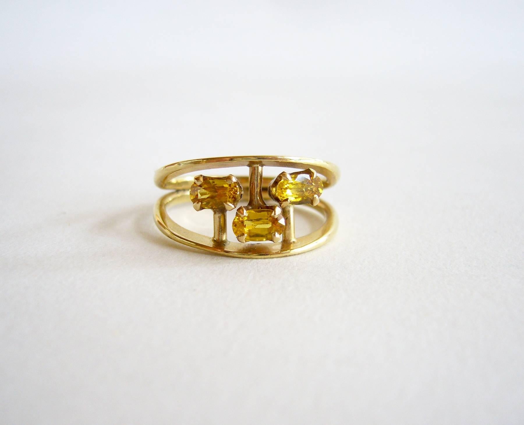 1960's 14k gold and yellow sapphire abstract modernist ring designed and created by American modernist jeweler Jack Nutting of San Francisco, California.  Ring is quite suitable for an engagement or wedding ring and could be worn daily.  A finger