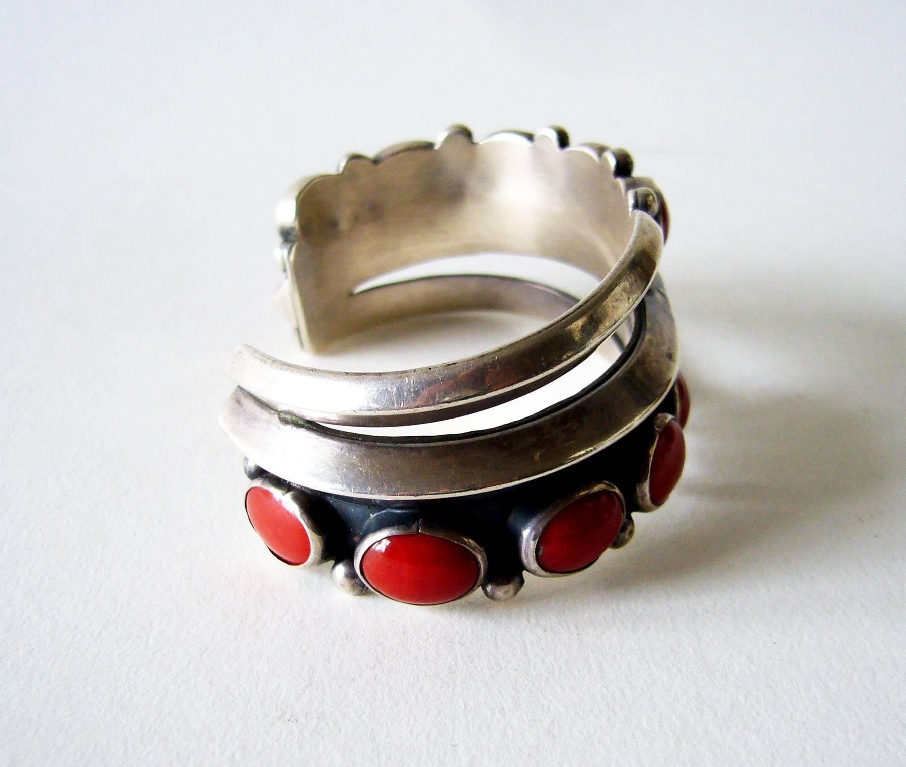Navajo red coral and sterling silver cuff bracelet circa 1970's.  Bracelet measures 5.25