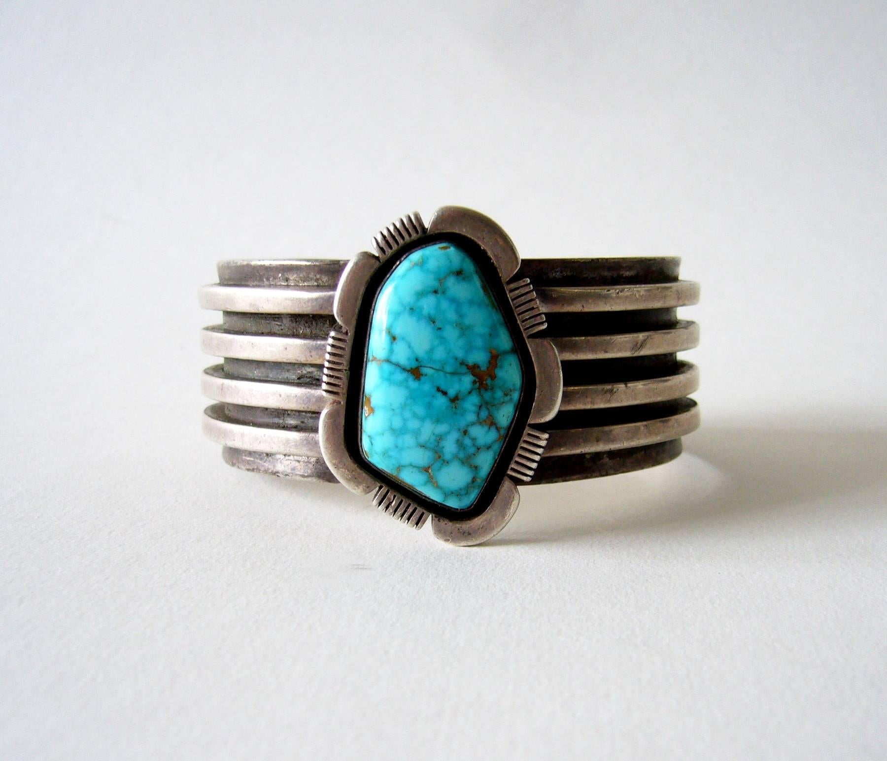 Kingman Turquoise Navajo bracelet, circa 1970's.   Bracelet is reminiscent of Kenneth Begay designs.  It has an inside circumference of 6.5