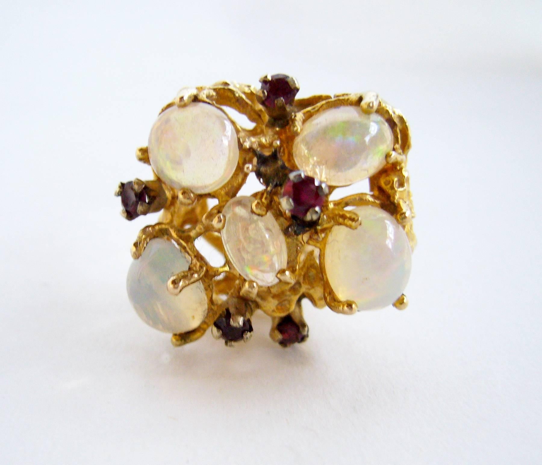 1960's 14k gold with branching settings containing opals and rubies.  Ring is a finger size 7 - 7.25.  Signed 14k and in very good condition.