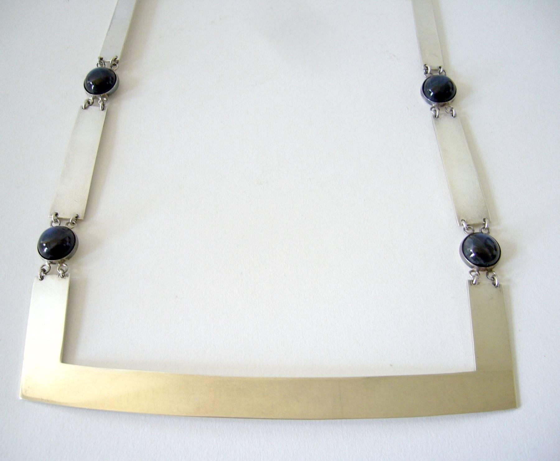 1970's sterling silver and shimmering dark blue labradorite cabochon necklace designed by Rauno Oma Matto for Kaunis Koru of Finland.  Necklace measures 11" long by 6.25" wide and is signed ROM, KK, T7 (1970), Finnish Hallmarks.  In very