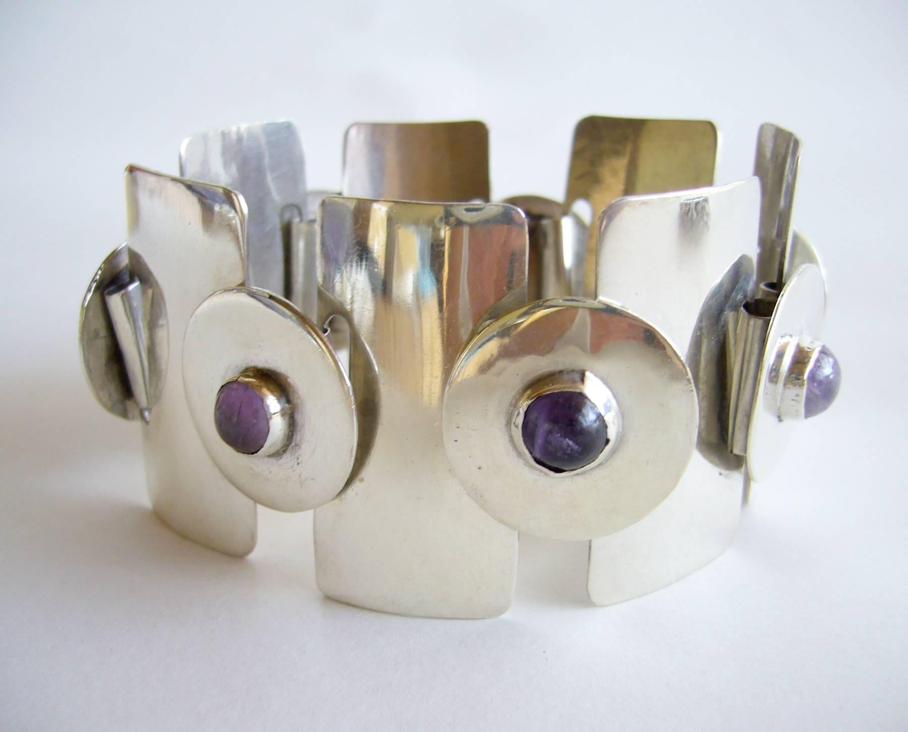 Silver and amethyst cabochon linked bracelet from Mexico circa 1960.  Bracelet measures 7.5